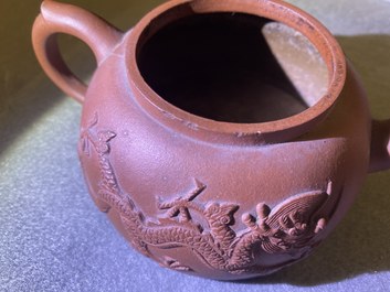 Two Chinese Yixing stoneware teapots and a famille rose 'Shou Lao' group, Kangxi and 20th C.